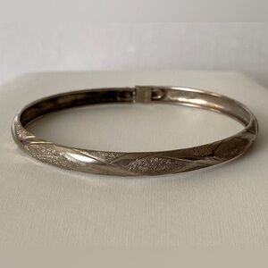 sold Vintage etched 925 sterling silver clasp bangle